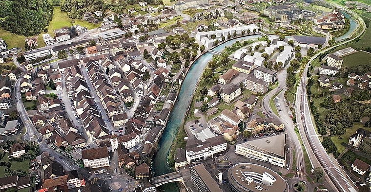 Weisse Häusergruppen: Wohnsiedlungen Nau Süd und Nau Nord, dazwischen die Birs. Foto: zvg